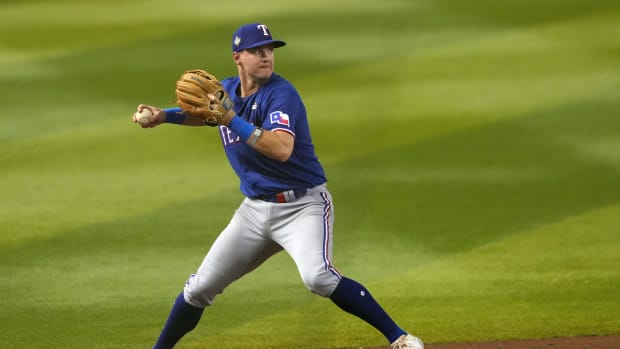 Oct 30, 2023; Phoenix, Arizona, USA; Texas Rangers third baseman Josh Jung (6) throws to first in the fifth inning against the Arizona Diamondbacks in game three of the 2023 World Series at Chase Field. Mandatory Credit: Joe Camporeale-USA TODAY Sports  